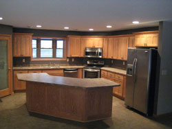 A kitchen with a half hexagon shaped island